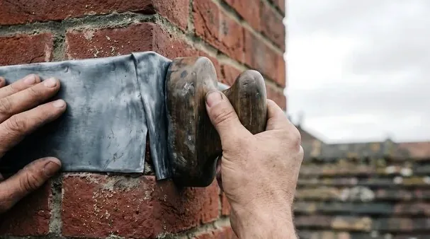Chimney flashing being sealed in Capitol Hill
